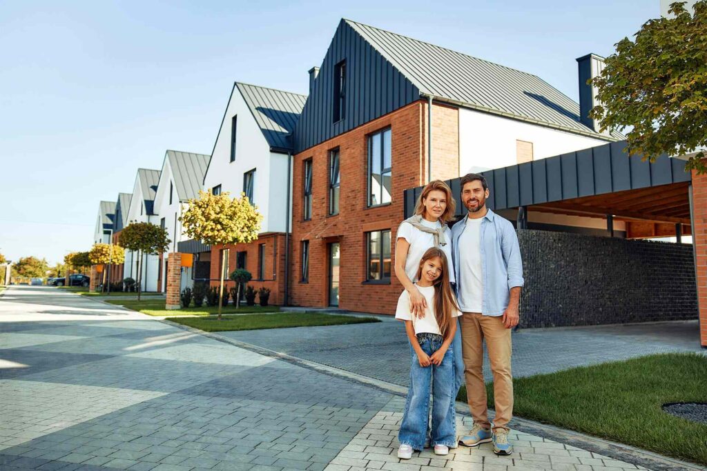 Family moving into a new home after buying, supported by trusted real estate agents in New York